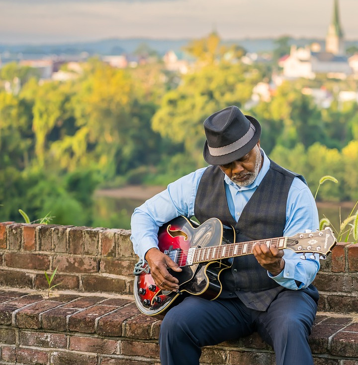 friendly caregiver with senior at home